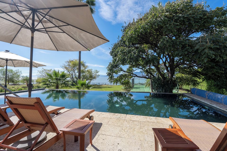 Outdoor pool, pool umbrellas, sun loungers