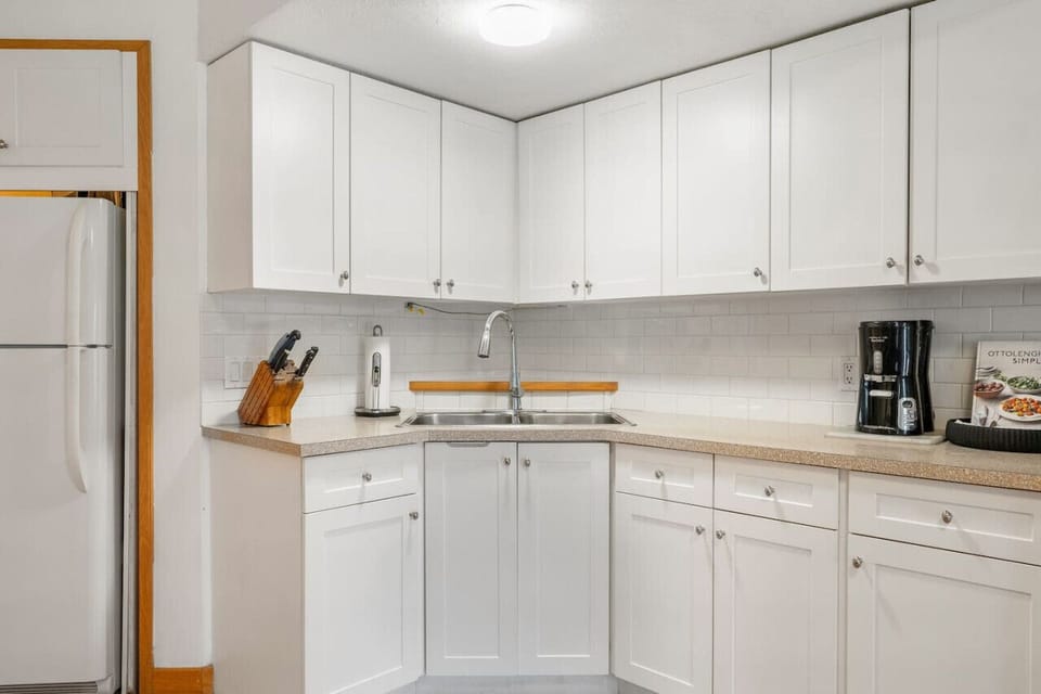 Full kitchen with a drip coffee maker, ground coffee, tea & sugar provided.