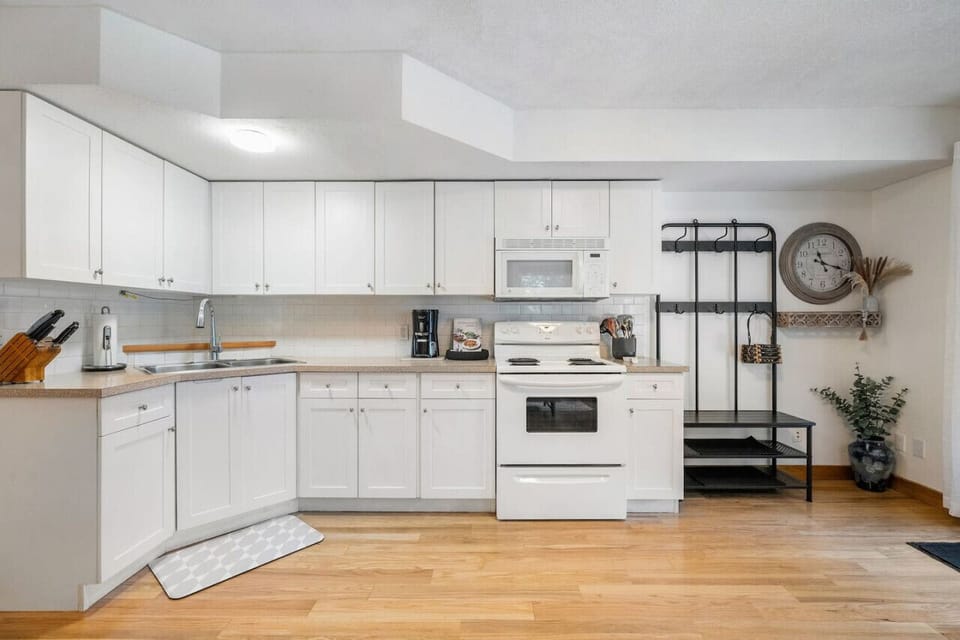 Full kitchen with a drip coffee maker, ground coffee, tea & sugar provided.