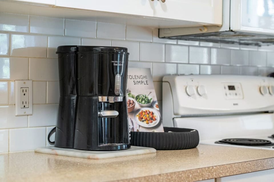 Full kitchen with a drip coffee maker, ground coffee, tea & sugar provided.