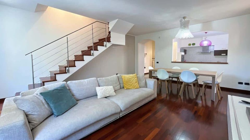 Bright and spacious living room with access to the upper floor