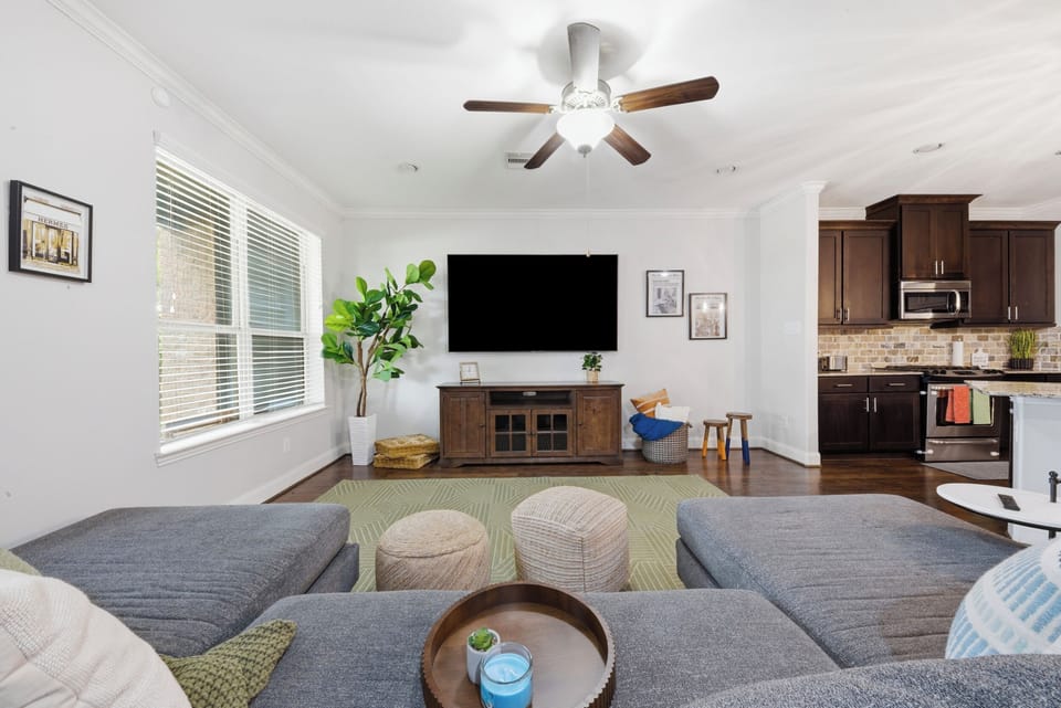 Living room - comfy couches & large TV, making this a very comfortable space.