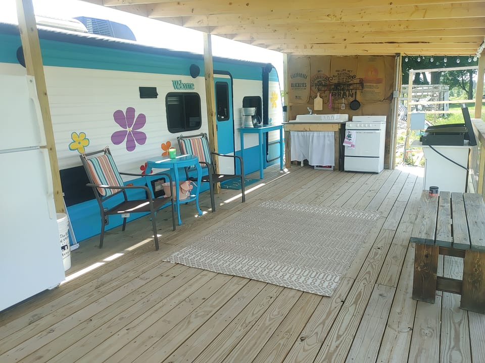Covered deck with full outdoor kitchen. 