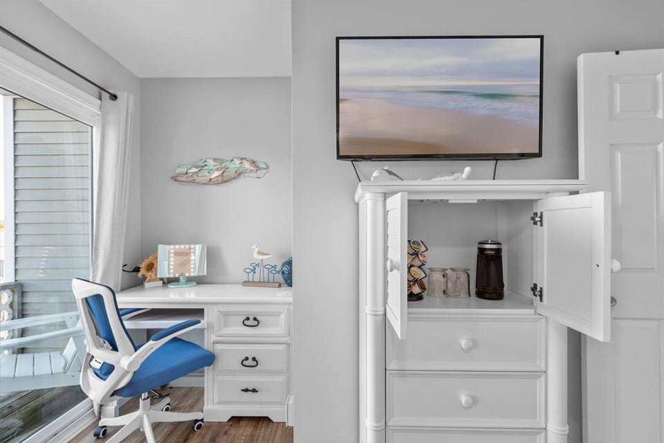 Coffee bar in the master bedroom under the smart TV. Start your day off right!