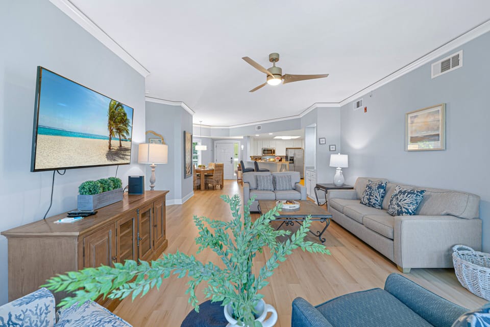 Coastal-inspired furnishings, luxury plank flooring, and soothing beach tones create a bright and welcoming atmosphere.