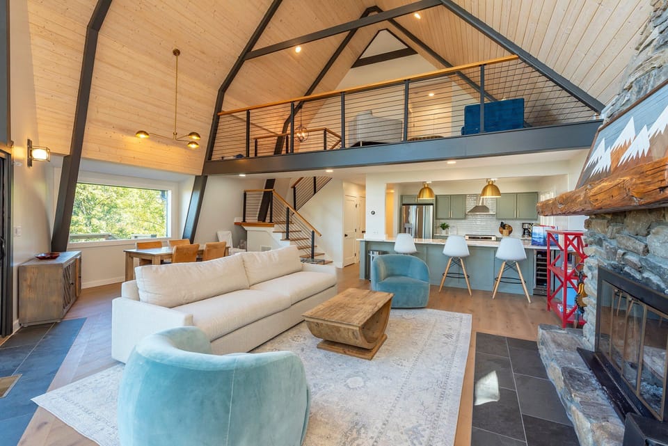Living room with wood-burning fireplace, Smart TV (streaming and cable available).