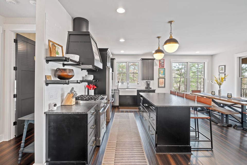 Impressive and well-equipped kitchen with gas range, dishwasher, and Keurig coffee maker