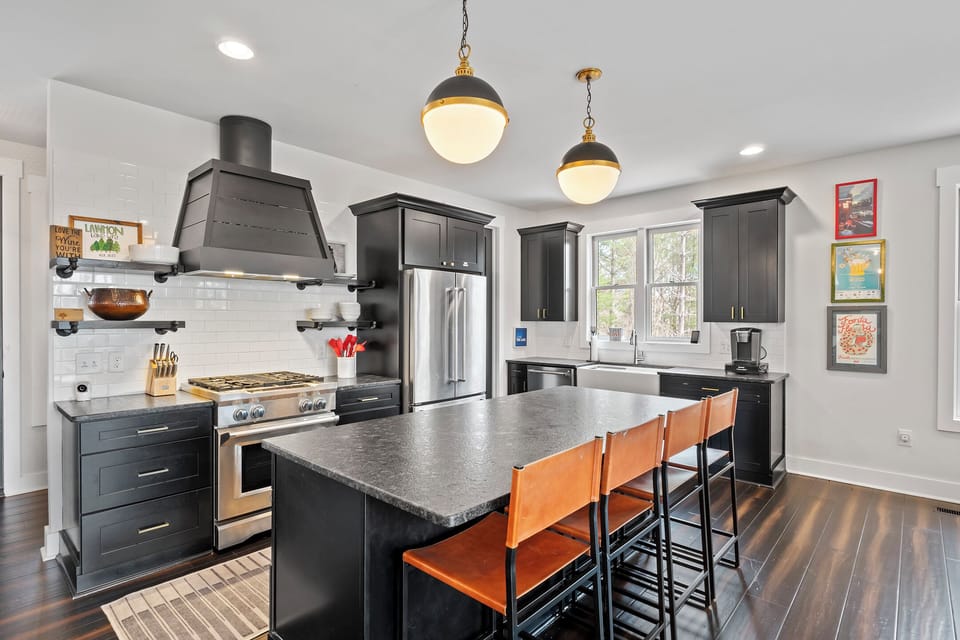 Impressive and well-equipped kitchen with gas range, dishwasher, and Keurig coffee maker
