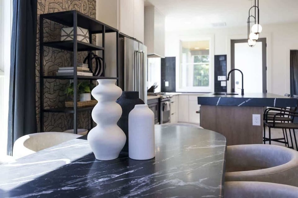 Upper Unit - 1st Floor: The dining table comfortably accommodates up to six guests.