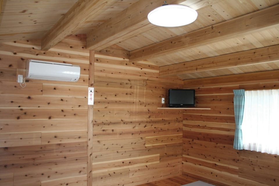 TV and air conditioning are provided. *Bedding is not provided. You must bring your own or rent a sleeping bag.*
