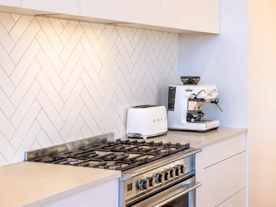 Fully Equipped Kitchen with Gas Hob, Oven, Coffee Machine, Fridge and Freezer.
