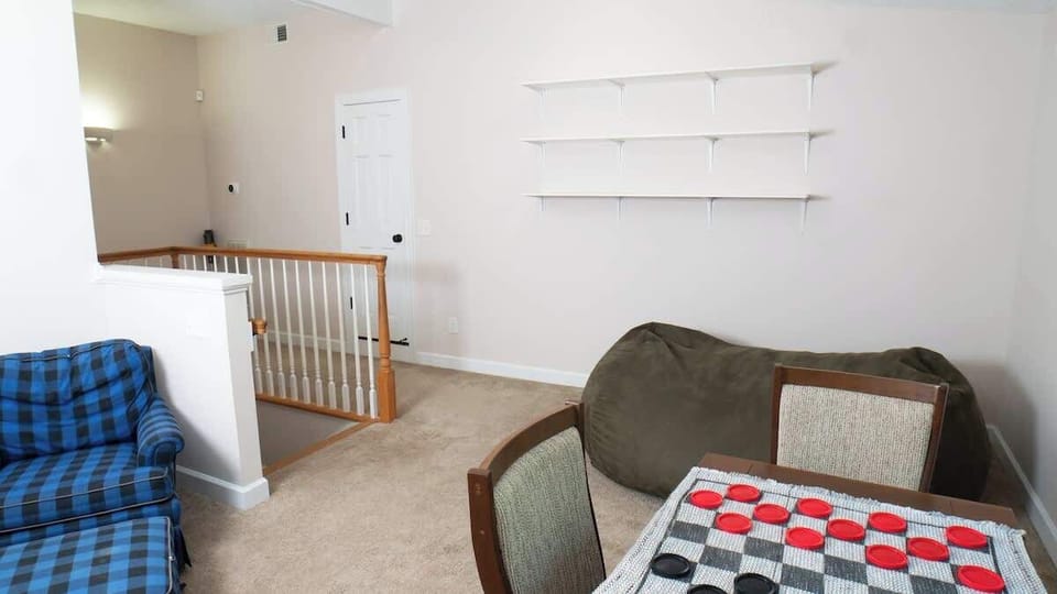 Second living room with games and comfortable seating.