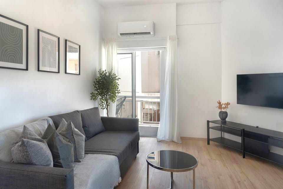 Luxury Apartment, City View | Living area | 43-inch Smart TV with cable channels