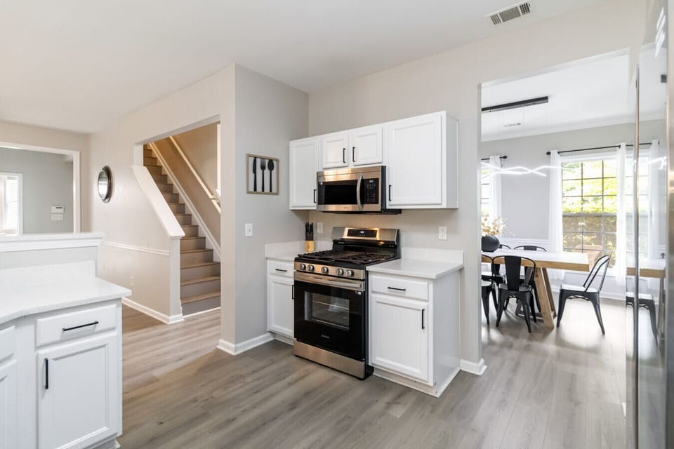 A fully equipped kitchen featuring a drip coffee maker, toaster, and all the essential kitchen supplies.