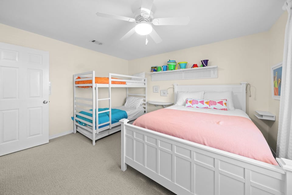 Perfect for families! Your kids will love the colorful bunk beds and spacious room with ceiling fan for comfort.