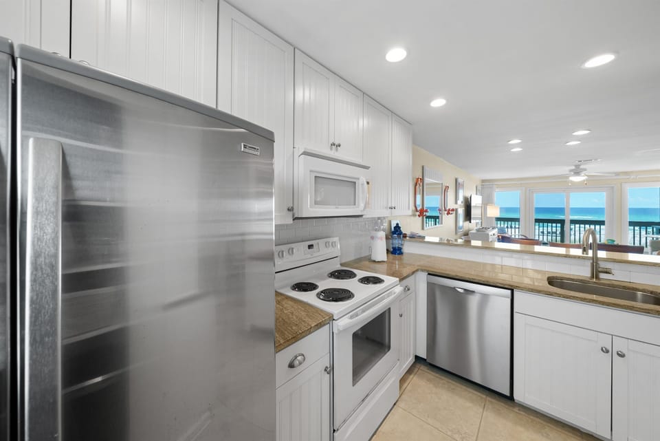 Cook with stunning ocean views in your fully equipped kitchen, featuring stainless steel appliances and everything you need for memorable meals.