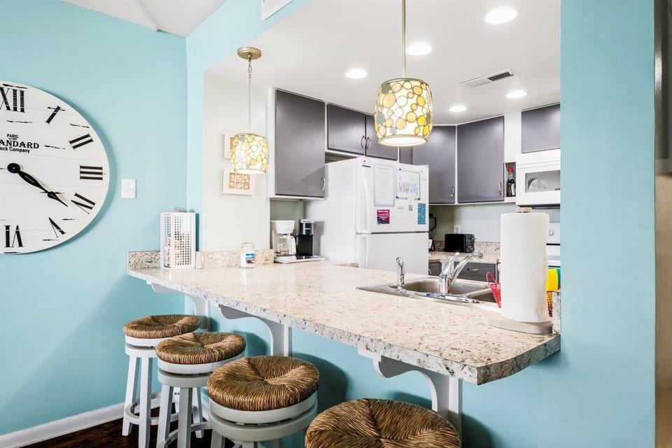 Our open kitchen flows right into the dining and living space—perfect for chatting while you cook.