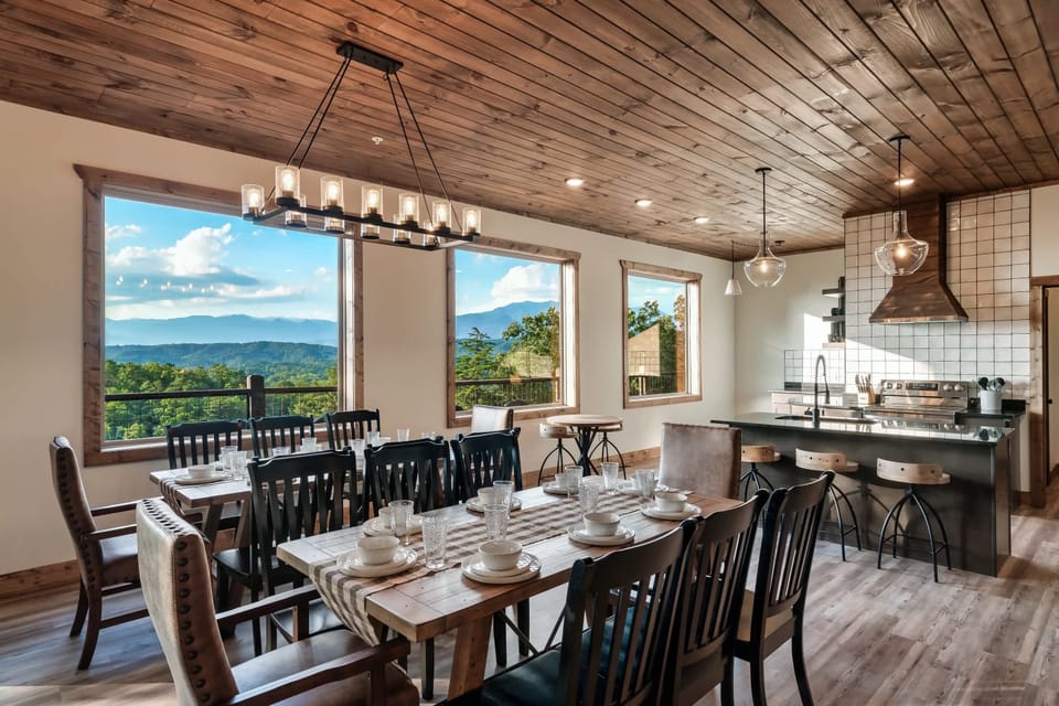 The dining room and kitchen have an unmatched view while you enjoy the family meals.