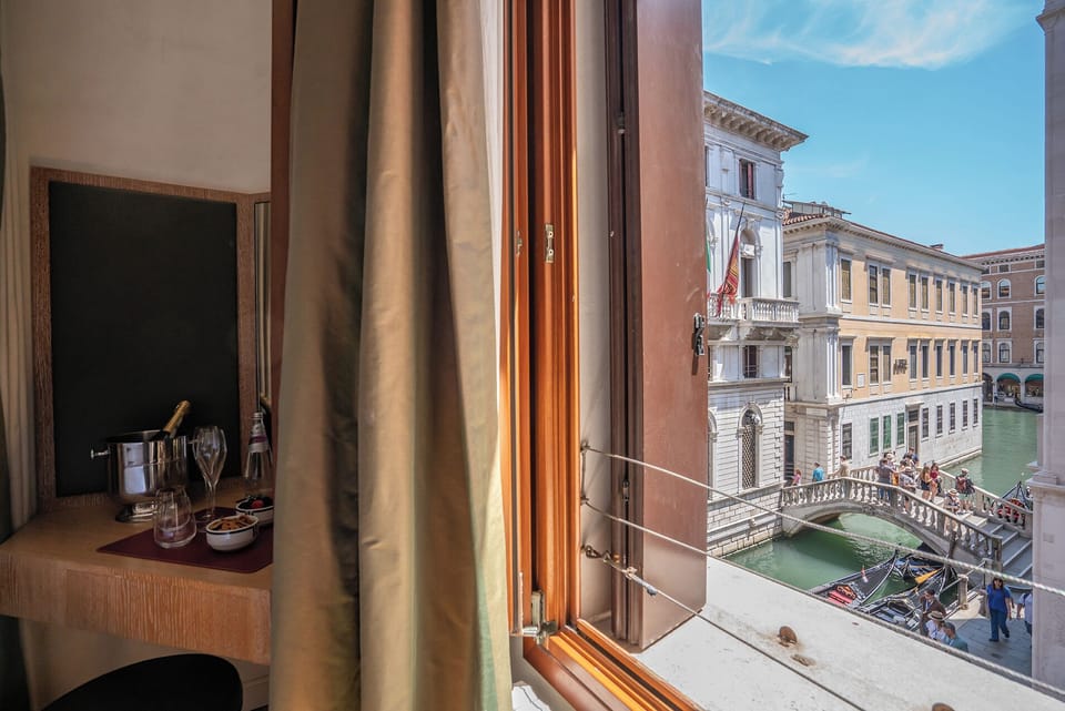 Superior Room, Balcony, Canal View | Minibar (free items), desk, WiFi (free), bed sheets