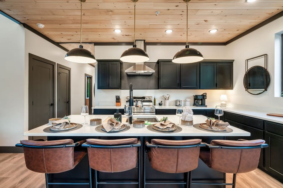 Kitchen island with additional space for serving and seating.