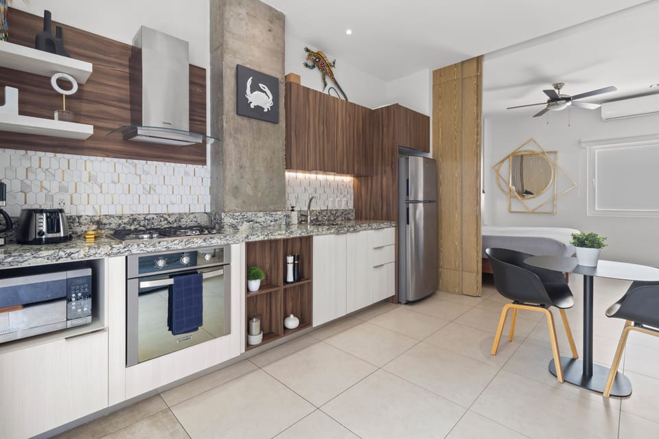 Kitchen amenities include a full-size fridge, stove, oven and microwave