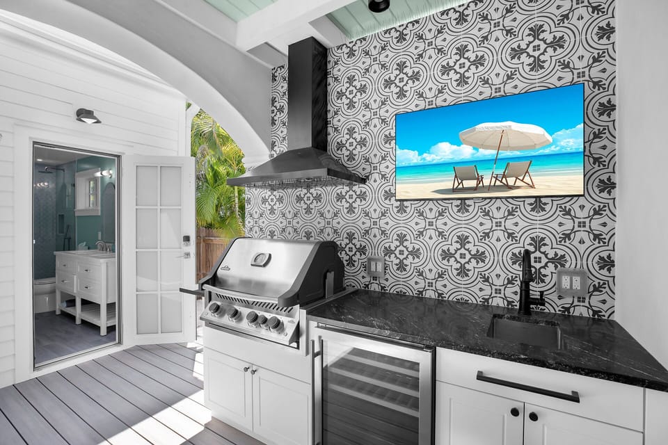 Full outdoor kitchen ,TV, and cottage bath access as well!