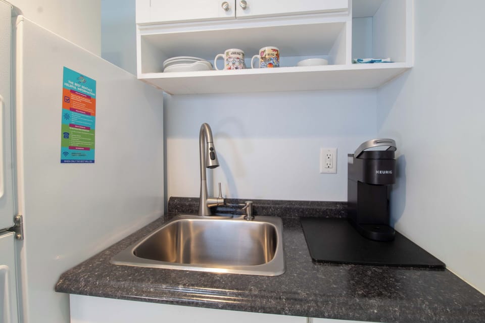 Your kitchenette features modern appliances and everything you need to brew your morning coffee. Bright, clean, and ready for your stay.