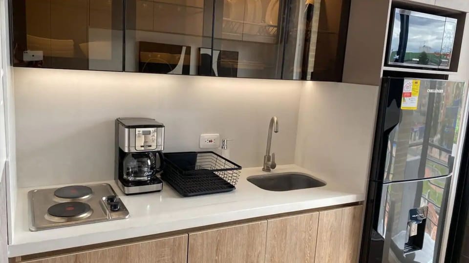 2-burner stove, full size fridge, microwave, and coffee machine