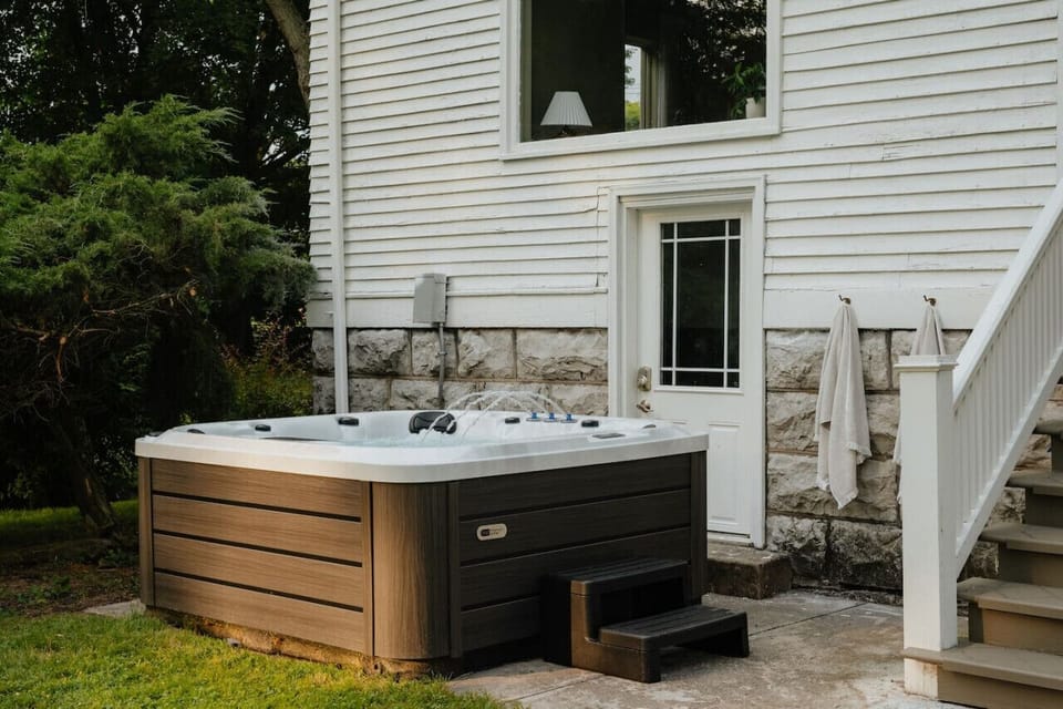 Unwind in the outdoor hot tub, the perfect spot to relax after a day of exploring.