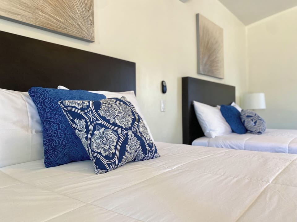Deluxe Quadruple Room | Minibar, blackout drapes, iron/ironing board, free WiFi
