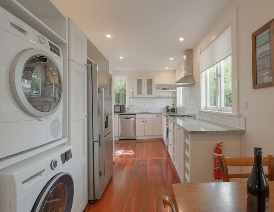 Kitchen, washer and dryer and dining area