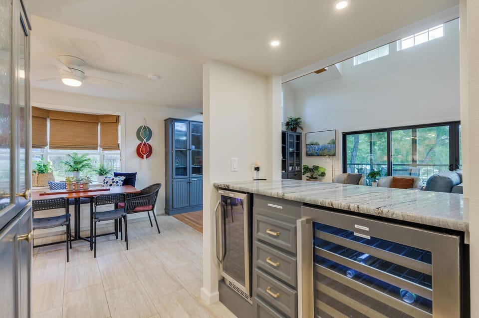 bar area with wine fridge and separate beverage fridge
