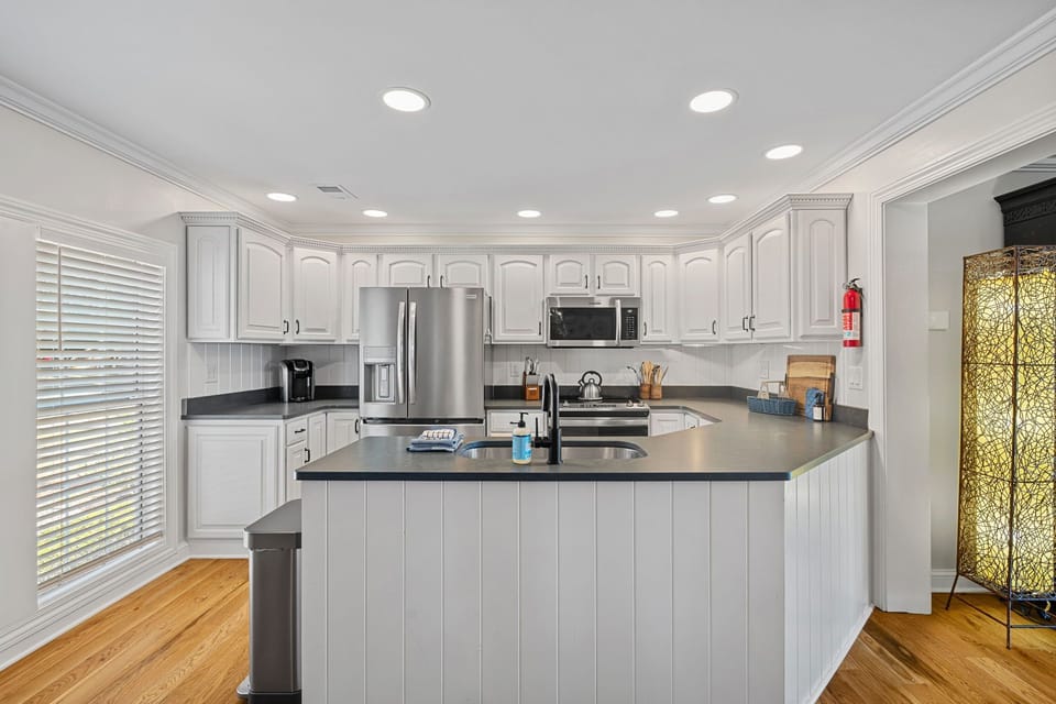 Fully stocked kitchen with large island to prep all your group meals.,