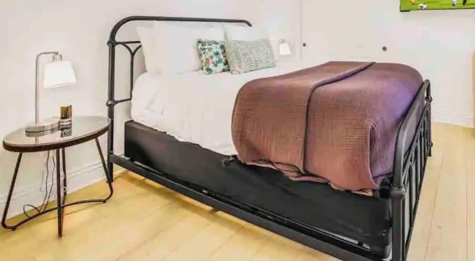 End your day in comfort in this modern bedroom with a queen bed