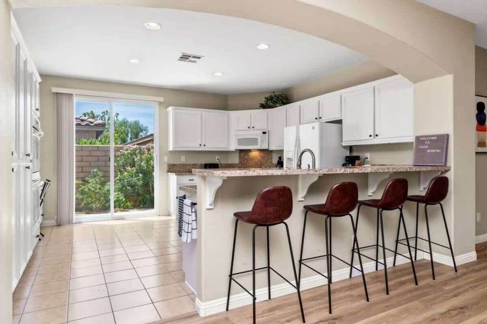 Fully equipped kitchen with bar seating and modern appliances