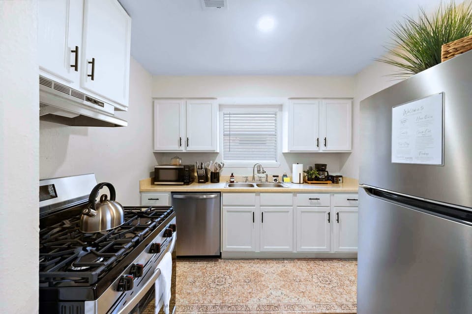 Kitchen: Modern appliances and sunny views make cooking a delight in this inviting space!