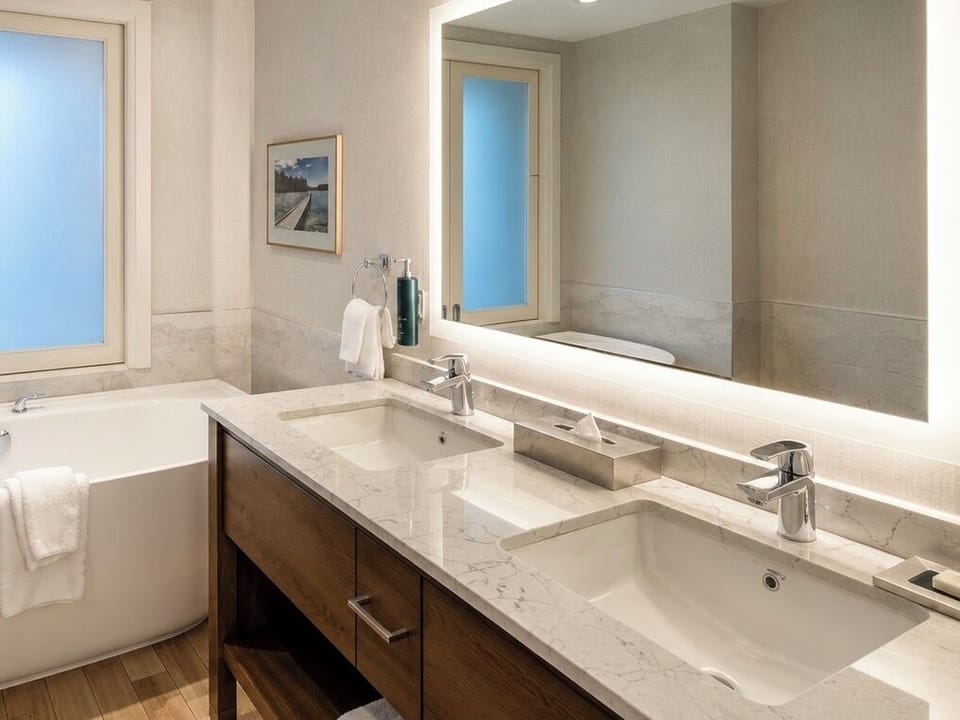 Premium Room, 1 King Bed, Soaker Tub, US Falls View | Bathroom | Hair dryer, towels, soap, shampoo