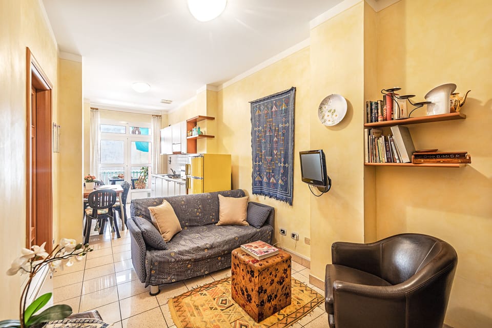 Classic Apartment, City View | Living area | 35-cm TV with digital channels