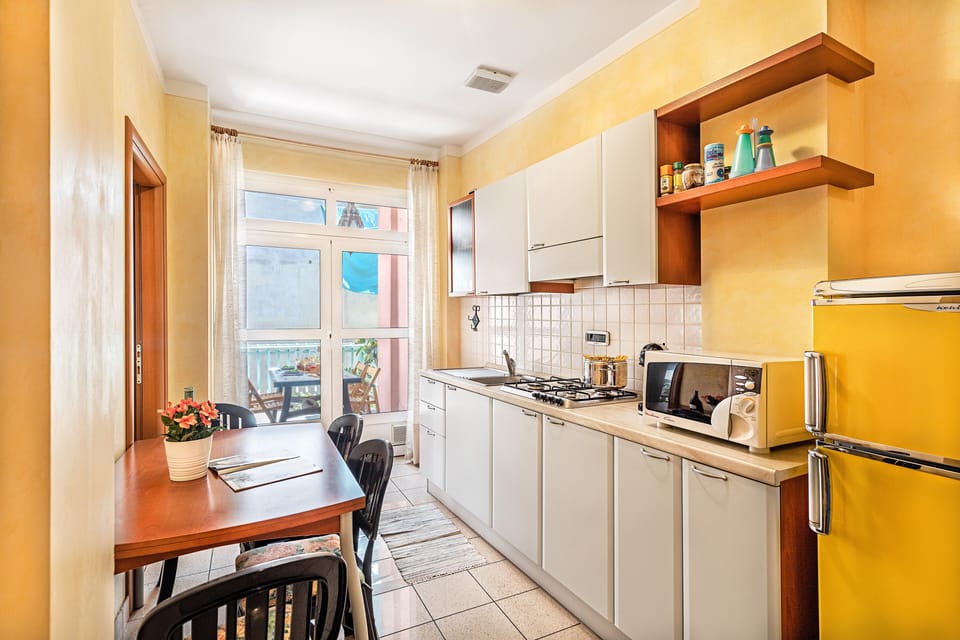 Classic Apartment, City View | Private kitchen | Fridge, microwave, stovetop, highchair