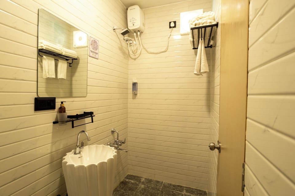 Shower, slippers, bidet, towels