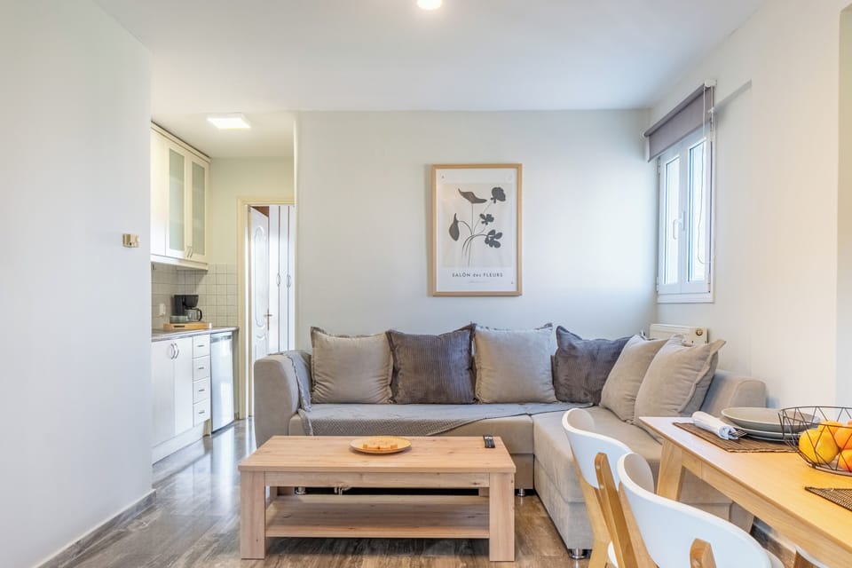 Deluxe Apartment, Sea View | Living area | Flat-screen TV