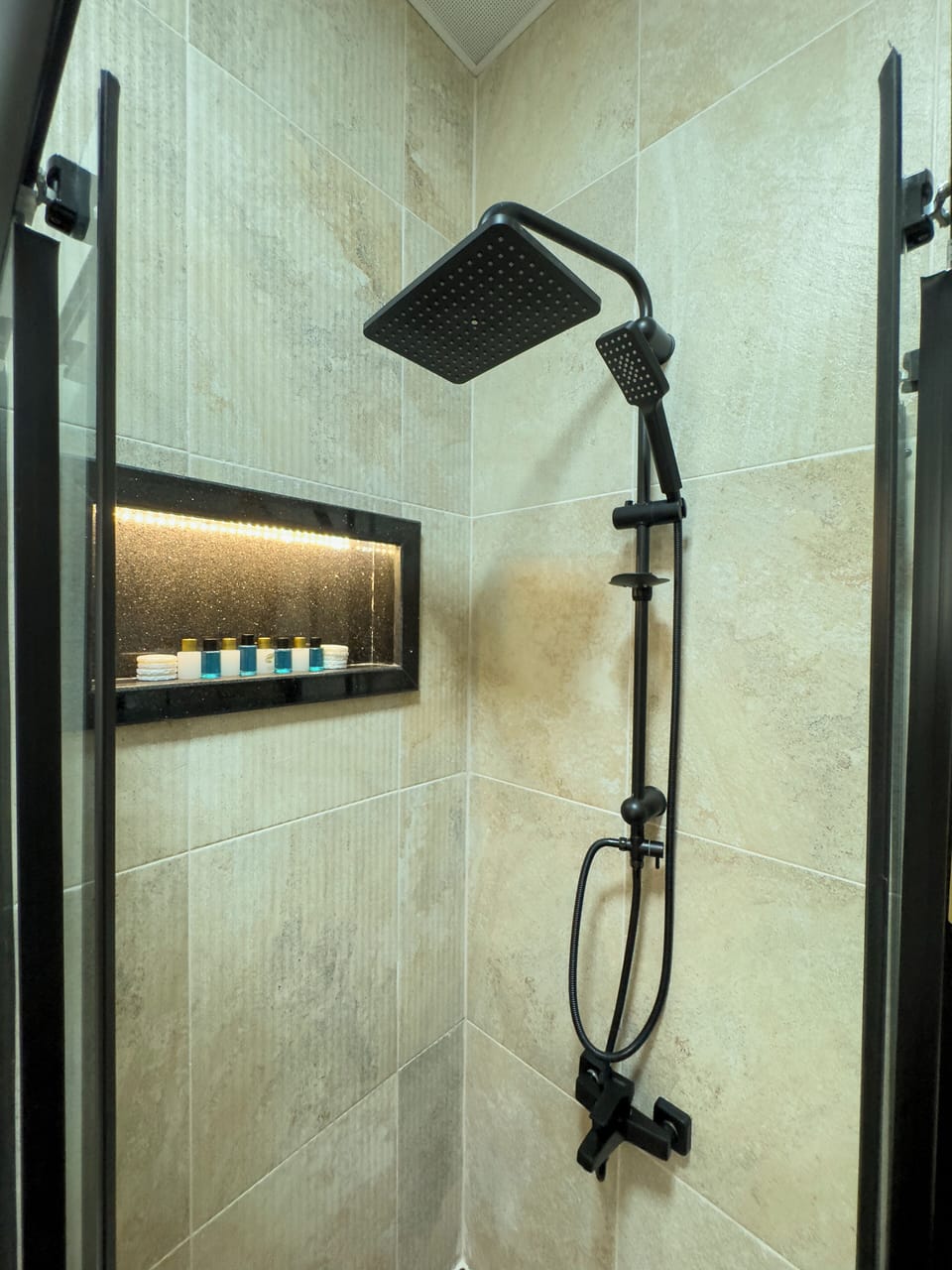 Shower, hair dryer, slippers, towels