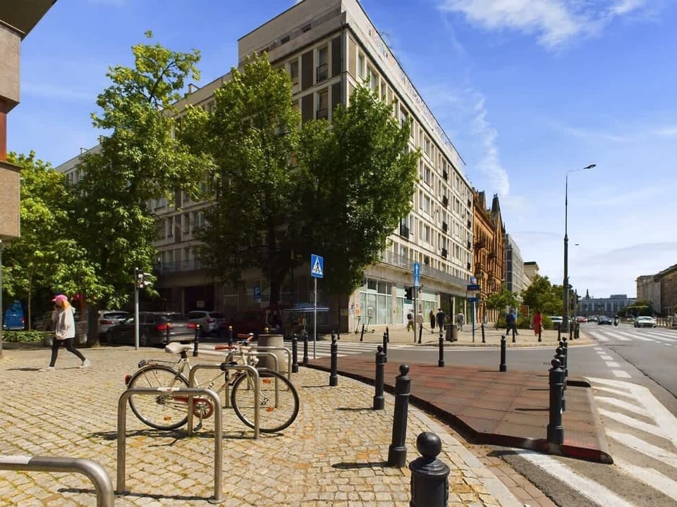 Outdoor city view with bicycles, trees, and charming urban surroundings near the apartment.