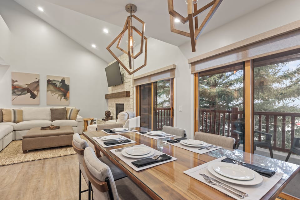 The dining area offers seating for 6 guests and large sliding glass doors next to it.