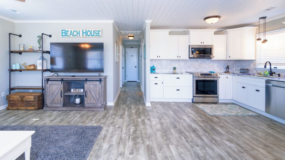 Living Area - This open concept living space is fully updated and offers a wow factor.