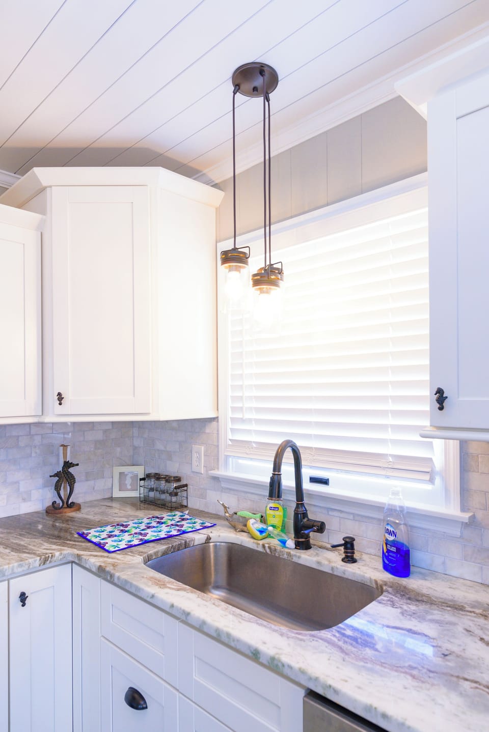 Kitchen - This kitchen is modern and marvelous it's stainless-steel appliances and back splash make this a beautiful place to entertain after a long beach day.