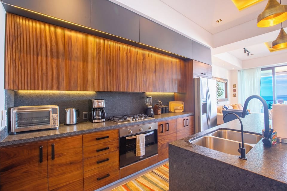 Kitchen amenities include a full-size fridge, stove, oven and dishwasher