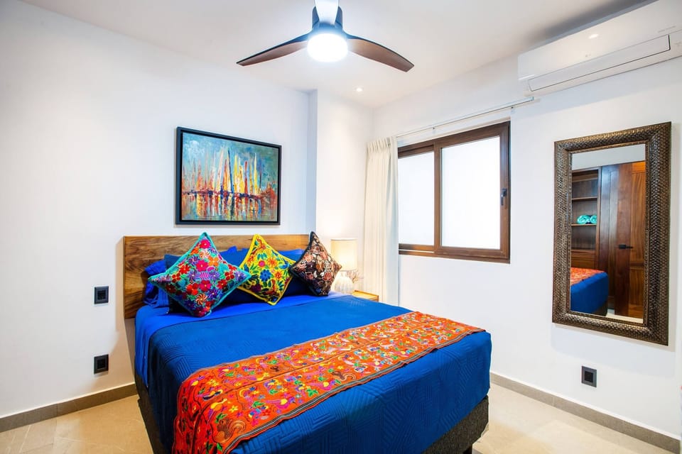 The guest bedroom features a queen-size bed
