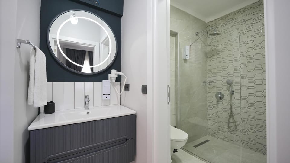 Shower, free toiletries, hair dryer, slippers