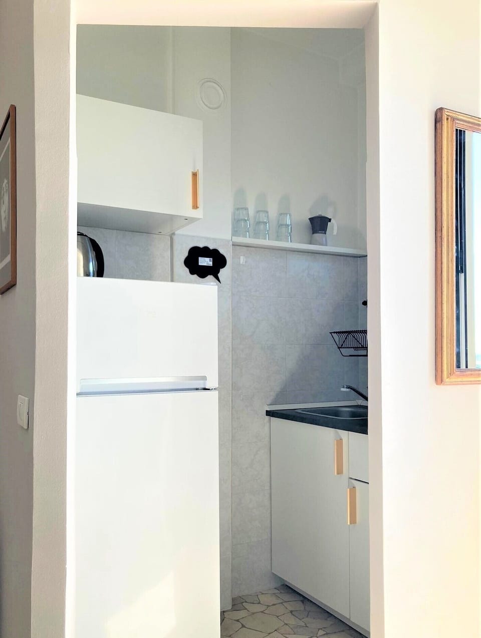 Full-size fridge, microwave, stovetop, cookware/dishes/utensils